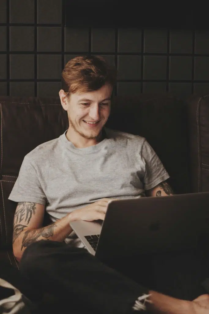 oleg ivanov man-sitting-facing-silver-macbook-inside-room